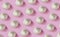 Ripe garlic pattern on a pink background, Vitamin concept