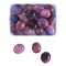 Ripe glossy plums of violet lilac color lie in and near a white plate on an isolated background. Top view. 3d rendering