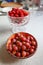 Ripe gooseberries in the bowl on the table.