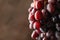 Ripe grape on brown background