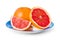 Ripe grapefruits on blue plate