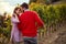 Ripe grapes in vineyard. family vineyard. Vineyards in autumn harvest. man and woman harvesting grape together in a vineyard