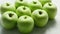 Ripe green apples in drops