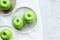 Ripe green apples stone table background top view space for text