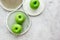 Ripe green apples stone table background top view space for text