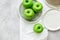 Ripe green apples stone table background top view space for text