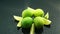 Ripe green limes on table