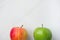 Ripe Green Red Organic Apples on White Marble Background. Lower Border. Creative Minimalist Image for Culinary Vegan Website