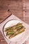 Ripe grilled asparagus. Wooden cutlery, healthy food concept