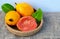 Ripe guava fruits in the basket on light background. Psidium guajava.Tropical fruits,healthy food or diet concept.