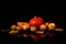 Ripe Hokkaido pumpkin, walnuts and ripe wild apples with yellow autumn leaves isolated on black background