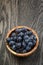 Ripe isabella grapes in wood bowl on table