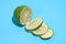 Ripe juicy delicious lime on blue background. Healthy eating and dieting concept