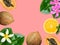 Ripe juicy papaya coconuts orange slice fuchsia white flowers green palm leaves on pink background. Tropical nature fruits summer