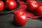 Ripe juicy red apples on black table