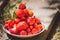 Ripe, juicy, red strawberry lying on a platter, close-up