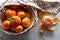 Ripe juicy tangerines in a bowl. Tangerine leaves. Fresh fragrant mandarins. Harvest tangerines