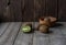 Ripe kiwi on a wooden background in a wooden bowl