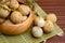 Ripe lanzones fruit on wooden table