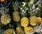 Ripe large batch of sweet and ripe pineapples for sale in public market