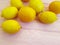 Ripe lemon group on a pink wooden half preparation background vegetarian freshness place for text