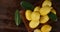 Ripe lemons with leaves on a plate to slowly rotate.