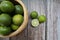 Ripe lime slice on rustic background- selected focus with copy space