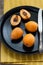 Ripe Loquat Fruit on Black Plate