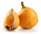 Ripe loquat and half on white background