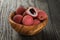 Ripe lychees in wood bowl