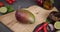 ripe mango fruit on a cutting board at the domestic kitchen
