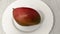 Ripe mango fruit on the white plate