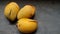 Ripe mango. Mango fruit whose skin was cracked peeled off because it fell from the tree. Selective focus.