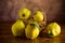 Ripe natural autumn quince on wooden table.