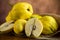 Ripe natural autumn quince on wooden table.