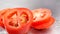 Ripe natural tomato. Fresh Tomato with dripping water. Organic tomato rotating in 4K resolution