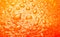 Ripe Orange Background texture with waterdrops macro studio shot