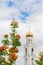 Ripe orange berries of the Rowan tree and the Orthodox Church in the background. The City Of Samara, Russia. The Iversky monastery
