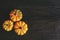 Ripe orange pumpkins on a dark wooden background. Minimalistic concept for Thanksgiving card or background