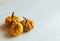 Ripe orange pumpkins on a white wooden background. Minimalistic concept for Thanksgiving card or background
