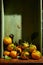 Ripe organic tangerines with leaves in wooden box in bright sunlight with copy space. Natural tropical fruit concept image