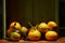 Ripe organic tangerines with leaves in wooden box in bright sunlight with copy space. Natural tropical fruit concept image