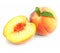 Ripe peach fruits with green leafs isolated