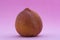 Ripe peach on a violet background