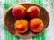 Ripe Peaches In A Wooden Bowl