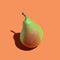 Ripe pear. Ripe juicy pear on orange background. Ripe fruit