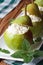 Ripe pears stuffed with cottage cheese closeup vertical