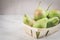 Ripe pears in a wooden box/ripe pears in a wooden box on a white marble table, selective focus and copyspace