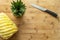 Ripe perfectly peeled pineapple, on a wooden background.