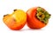 Ripe persimmon and juicy half on a white background. Isolated.